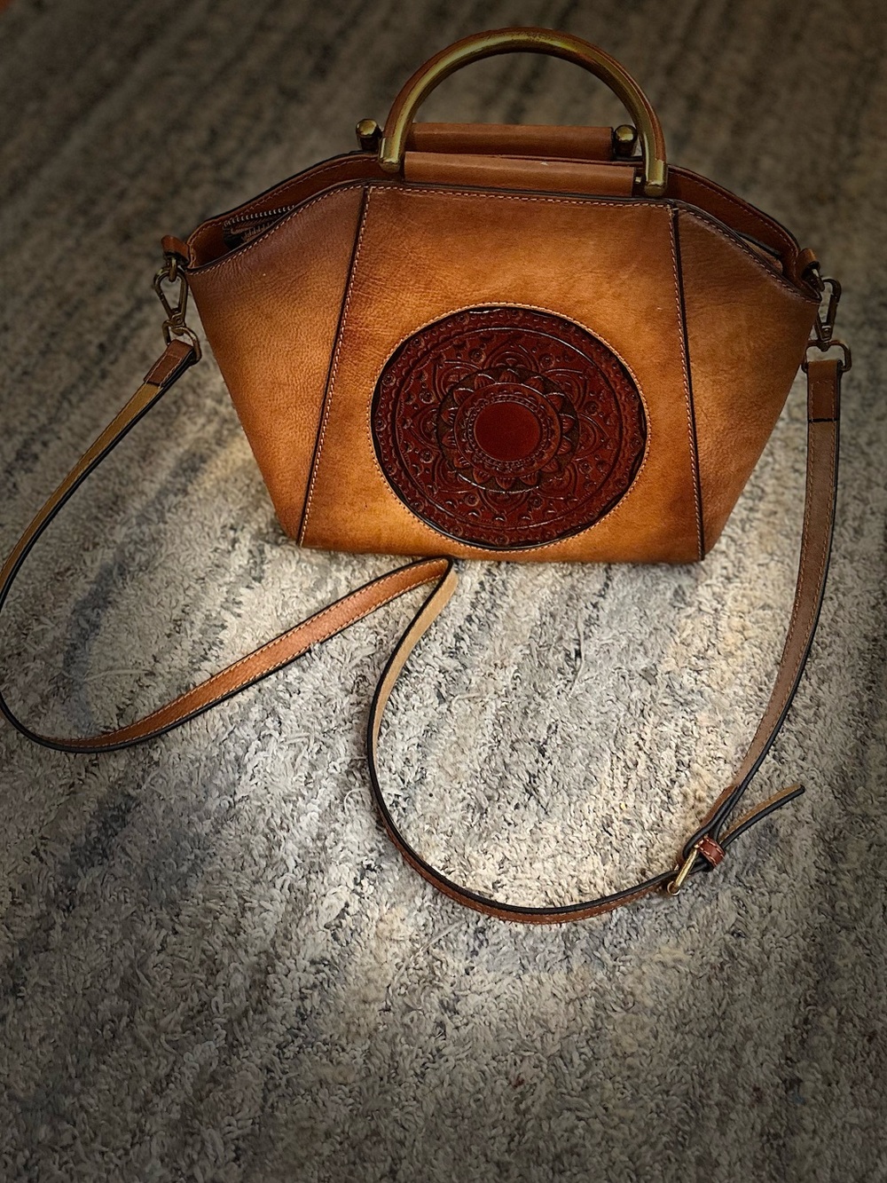 Brown Leather Crossbody Handbag with Embossed Medallion